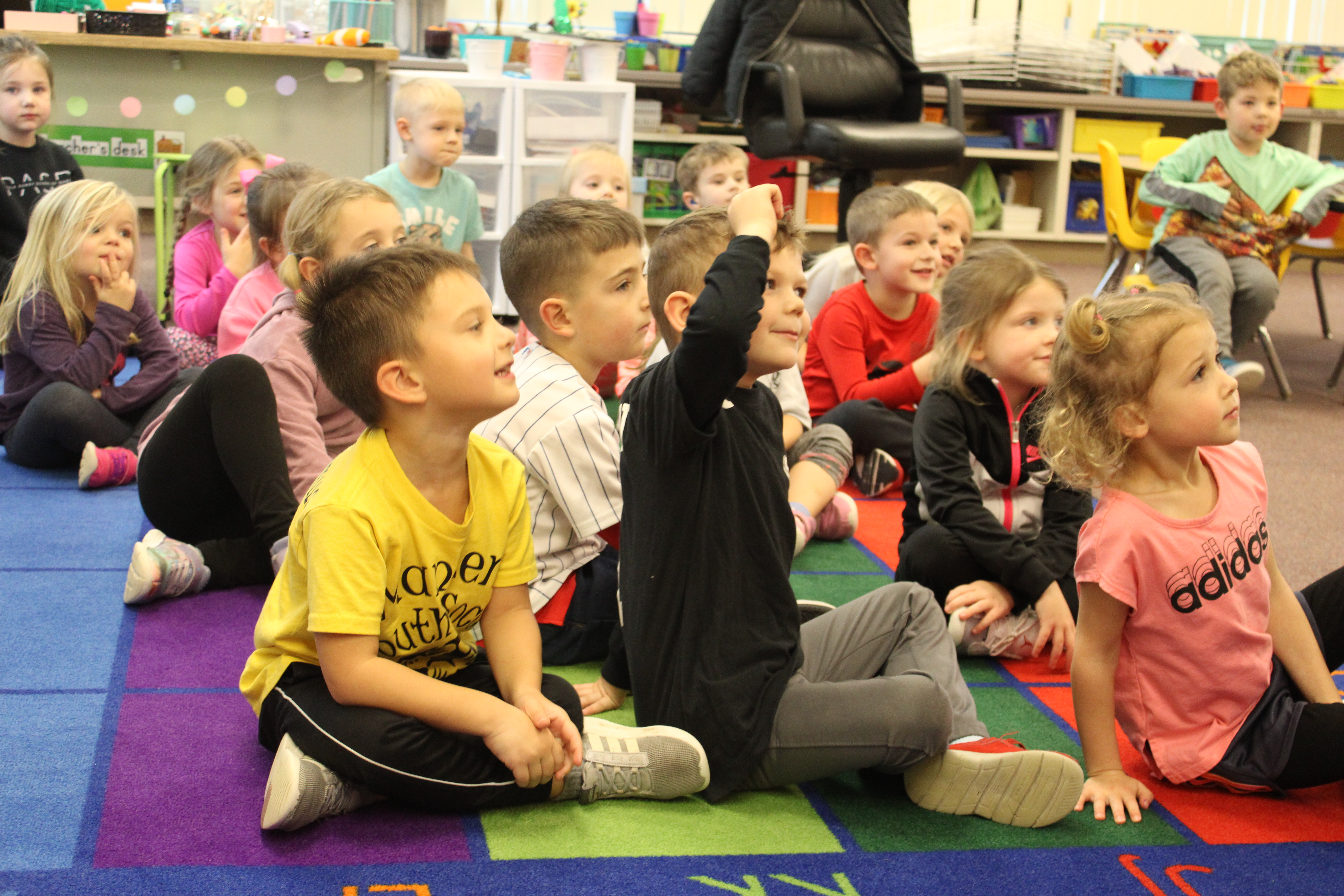 preschool boy sitting outside