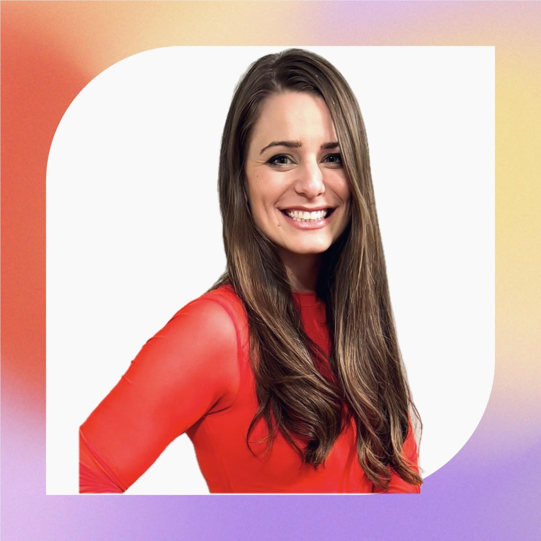 A woman with brown hair wearing a red shirt
