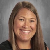 Woman with brown/blonde hair in smiling at the camera
