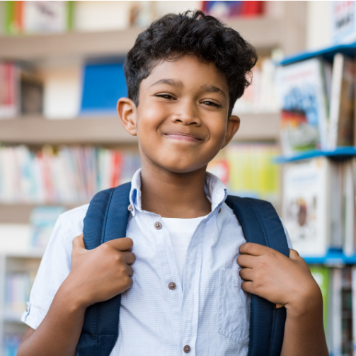 Student with bookbag in library