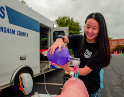 student participating in a CPR simulation