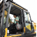 Student in cab of heavy equipment