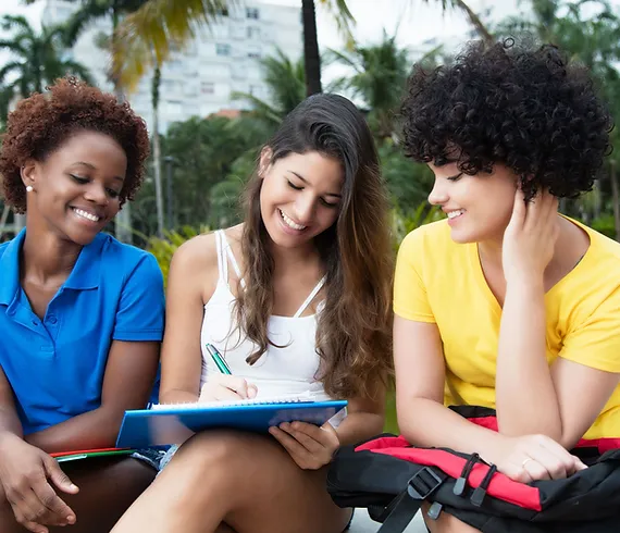 Female College Students working together outside of class