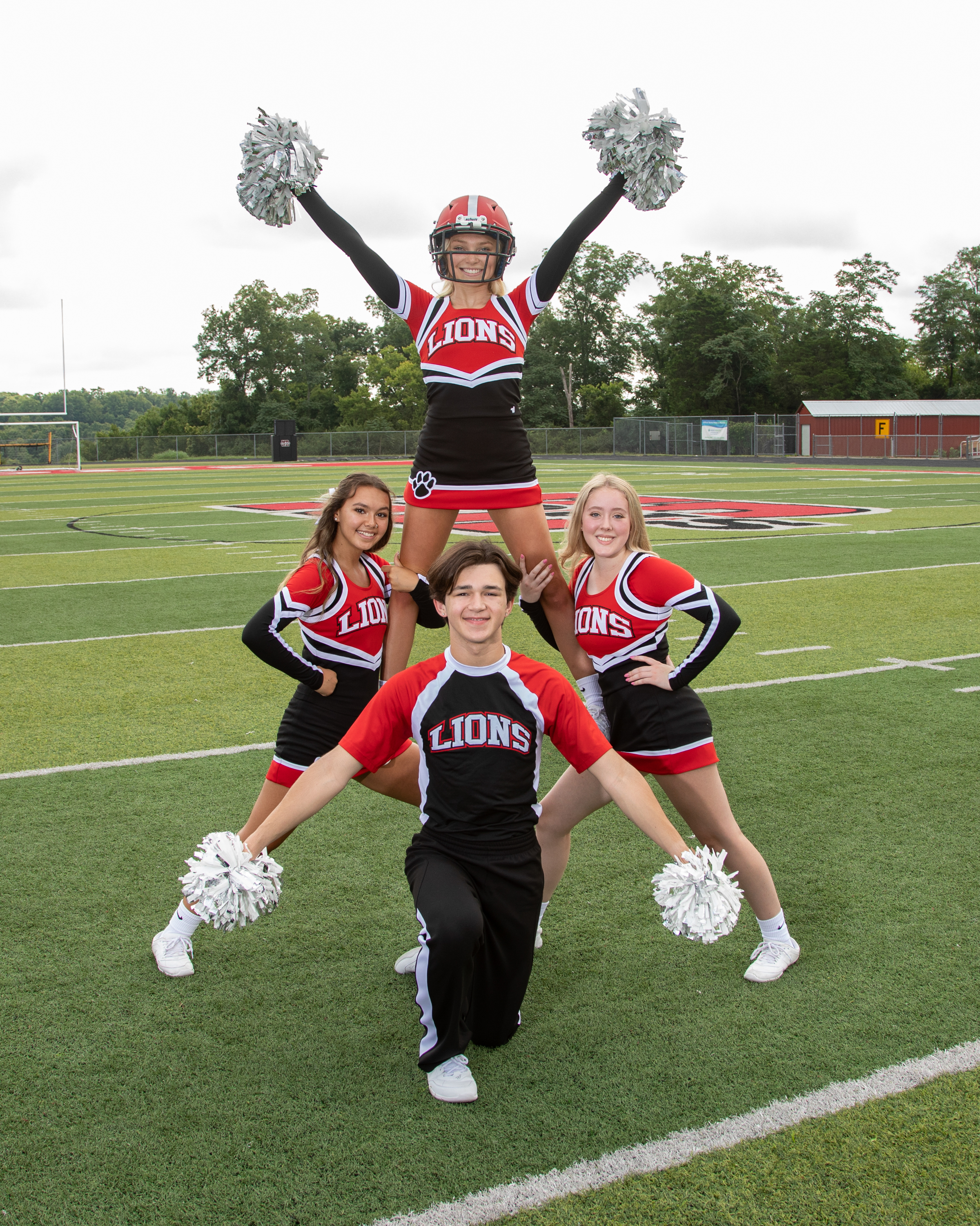Four cheerleaders posing