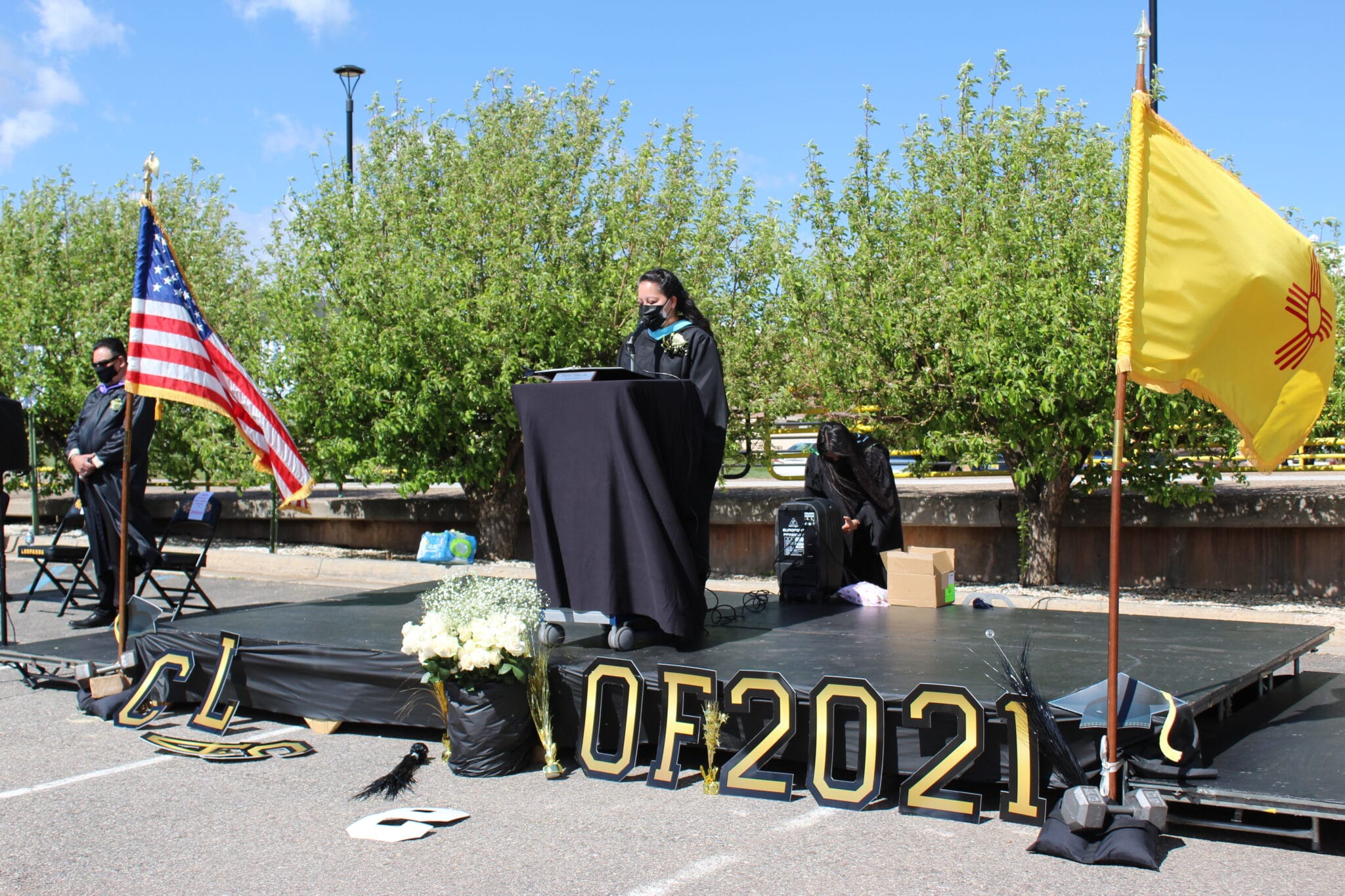 A group of students in graduation gowns and caps.