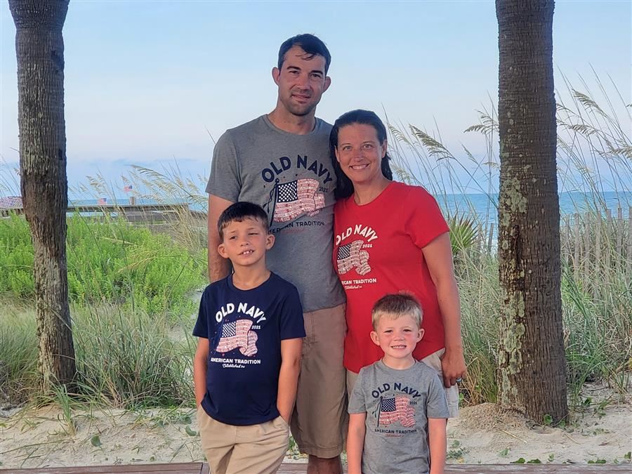 Mrs. Clark with her family at the beach