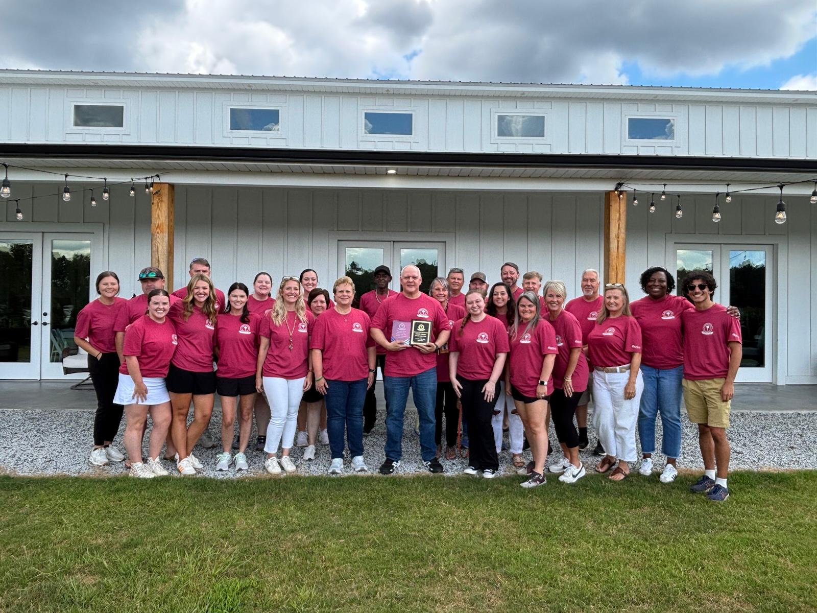 AHS staff with the  the District Teacher of the Year, Arnaldo Sabatino