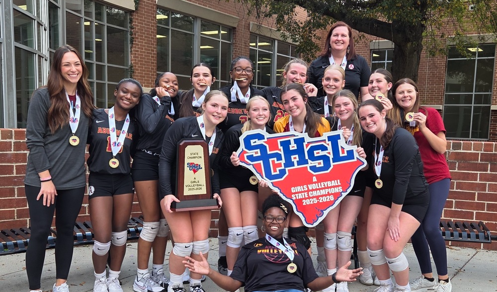 The Abbeville High School Volleyball State Champions holding their trophy