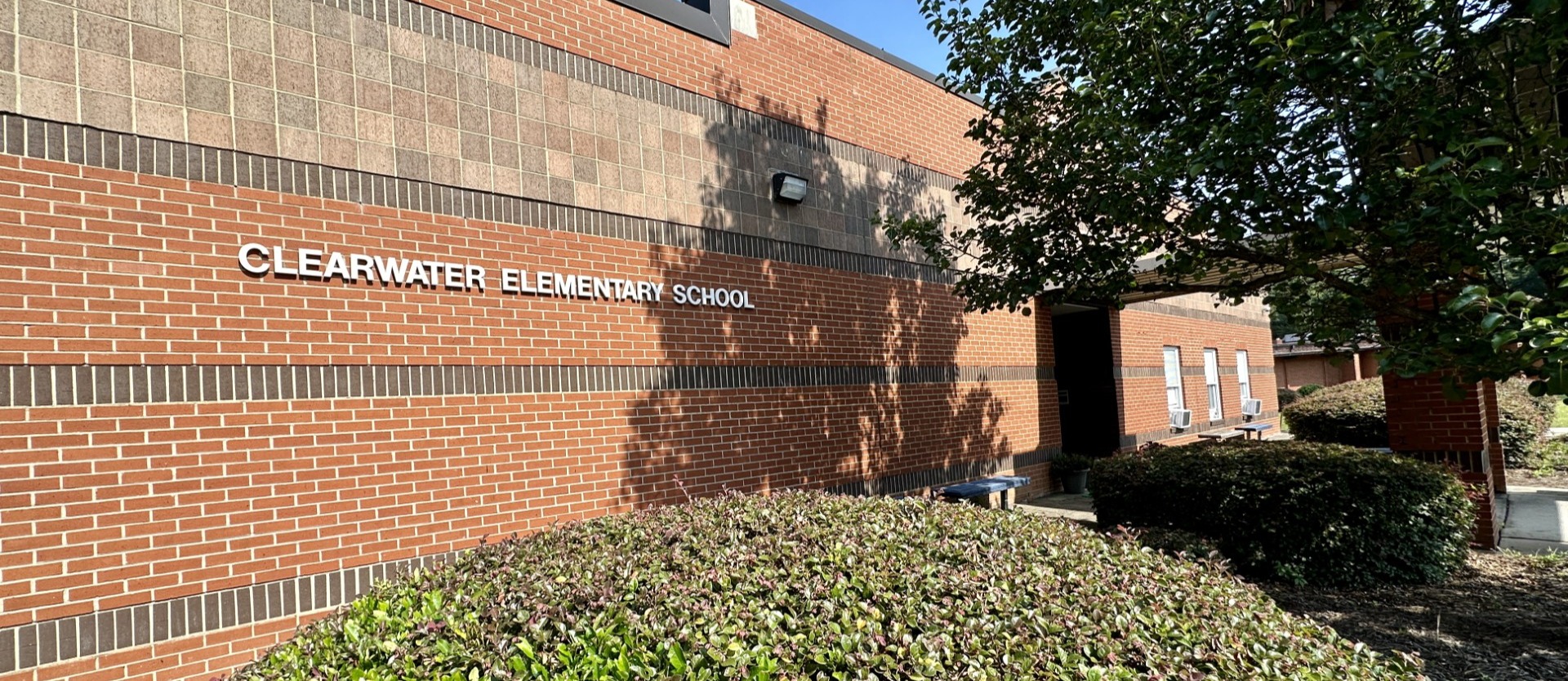 school sign in front of the building