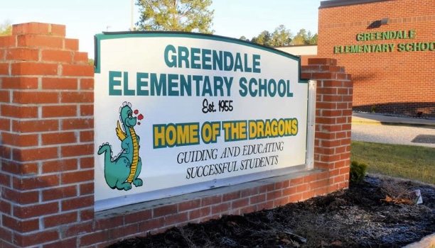 Greendale Elementary sign with cute dragon. Says "home of the dragons"