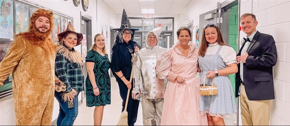 8 adults dressed Wizard of Oz