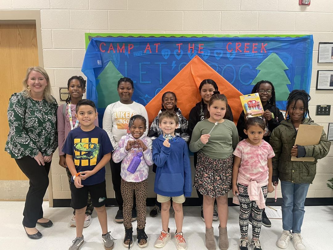 Ms. Lisa Harbin Christie with some students who are Turtle Ticket winners