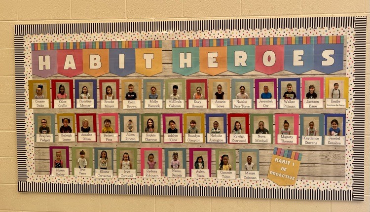 august 24 bulletin board with pictures of habit hero winners 