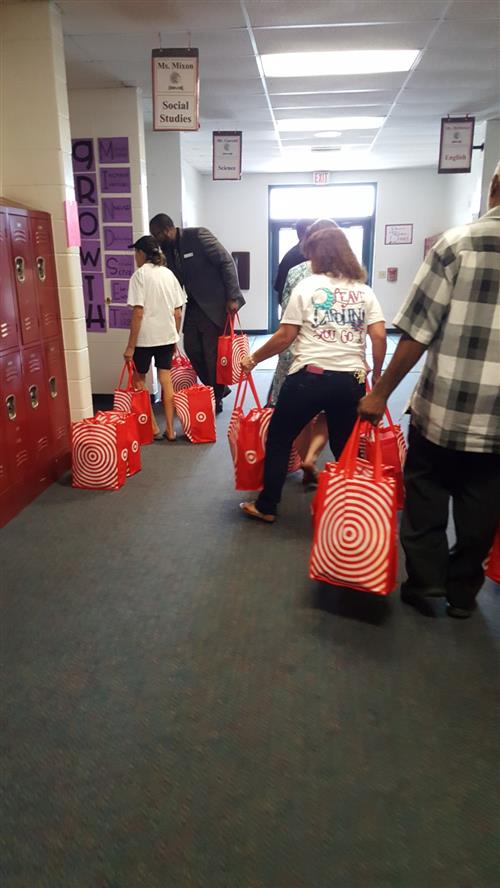 A group of people carrying donation bags