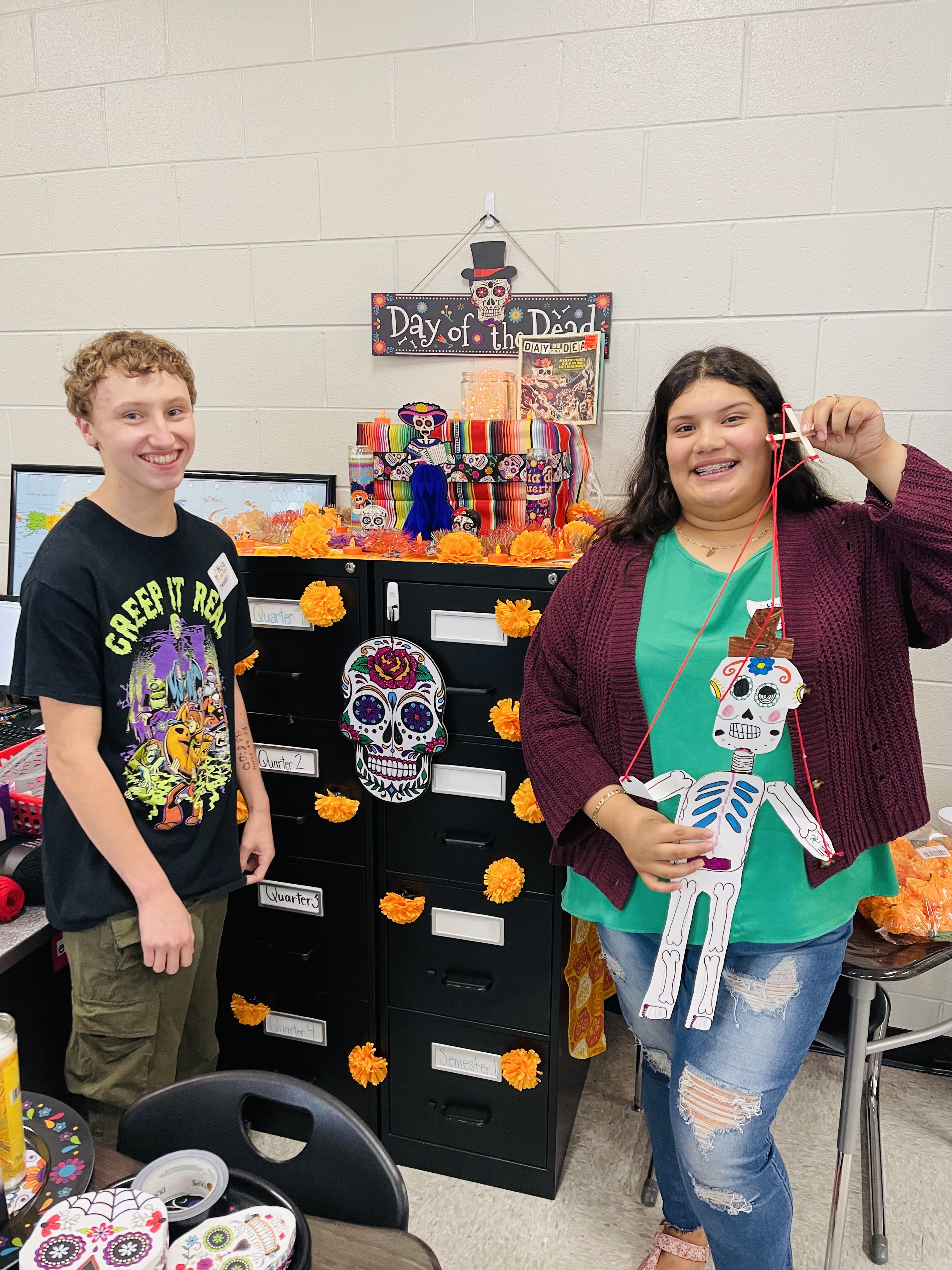 2 Students with Day of dead Skeletons