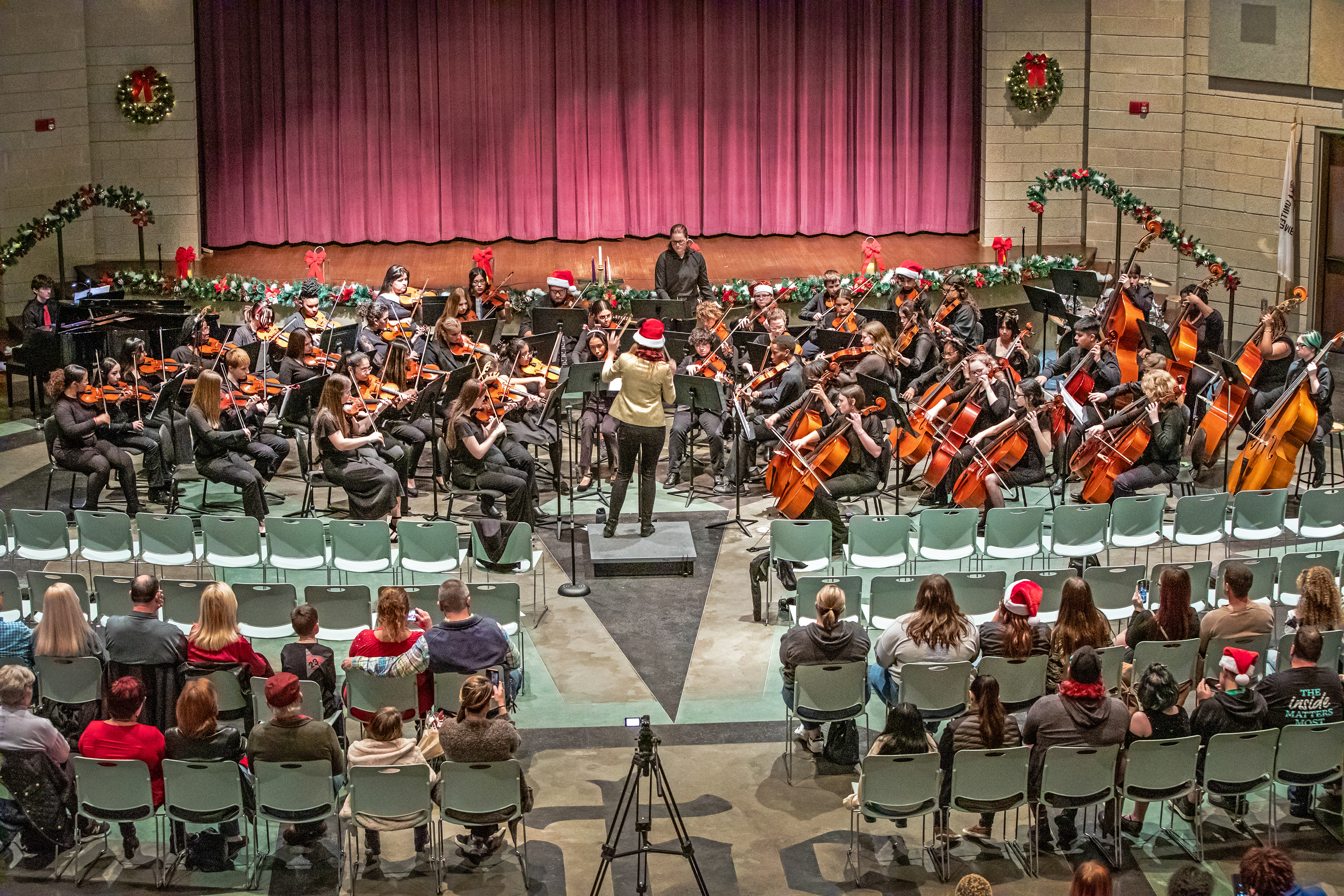 Students playing strings on concert stage