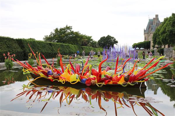 canoe full of flowers in the water