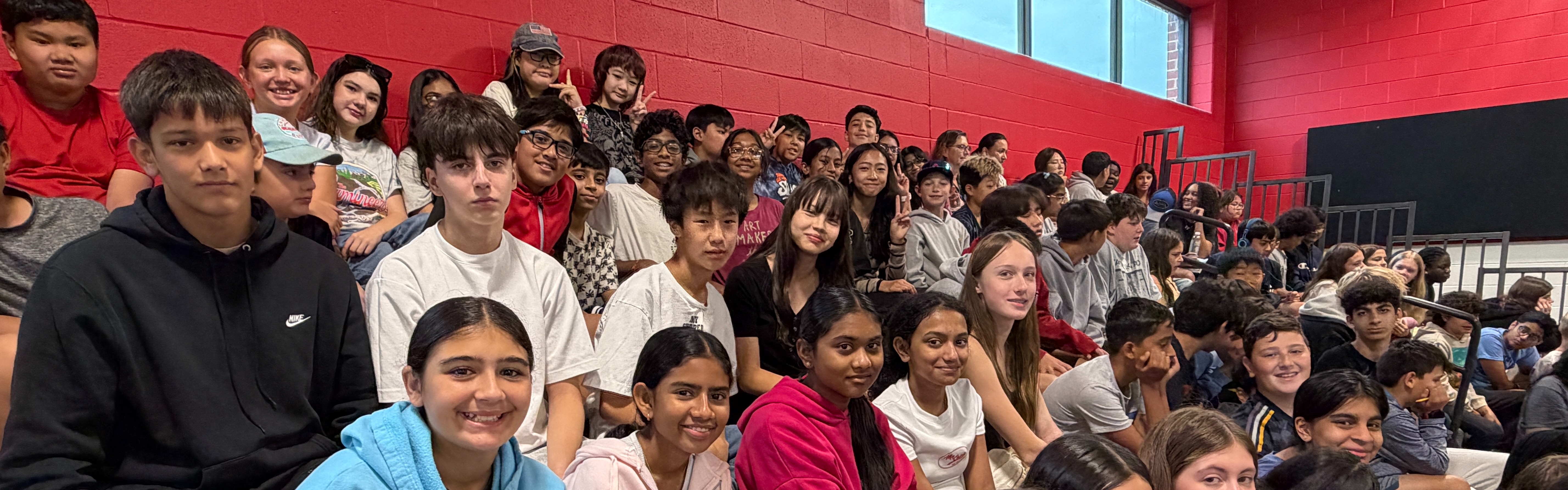 Students sitting in the bleachers.