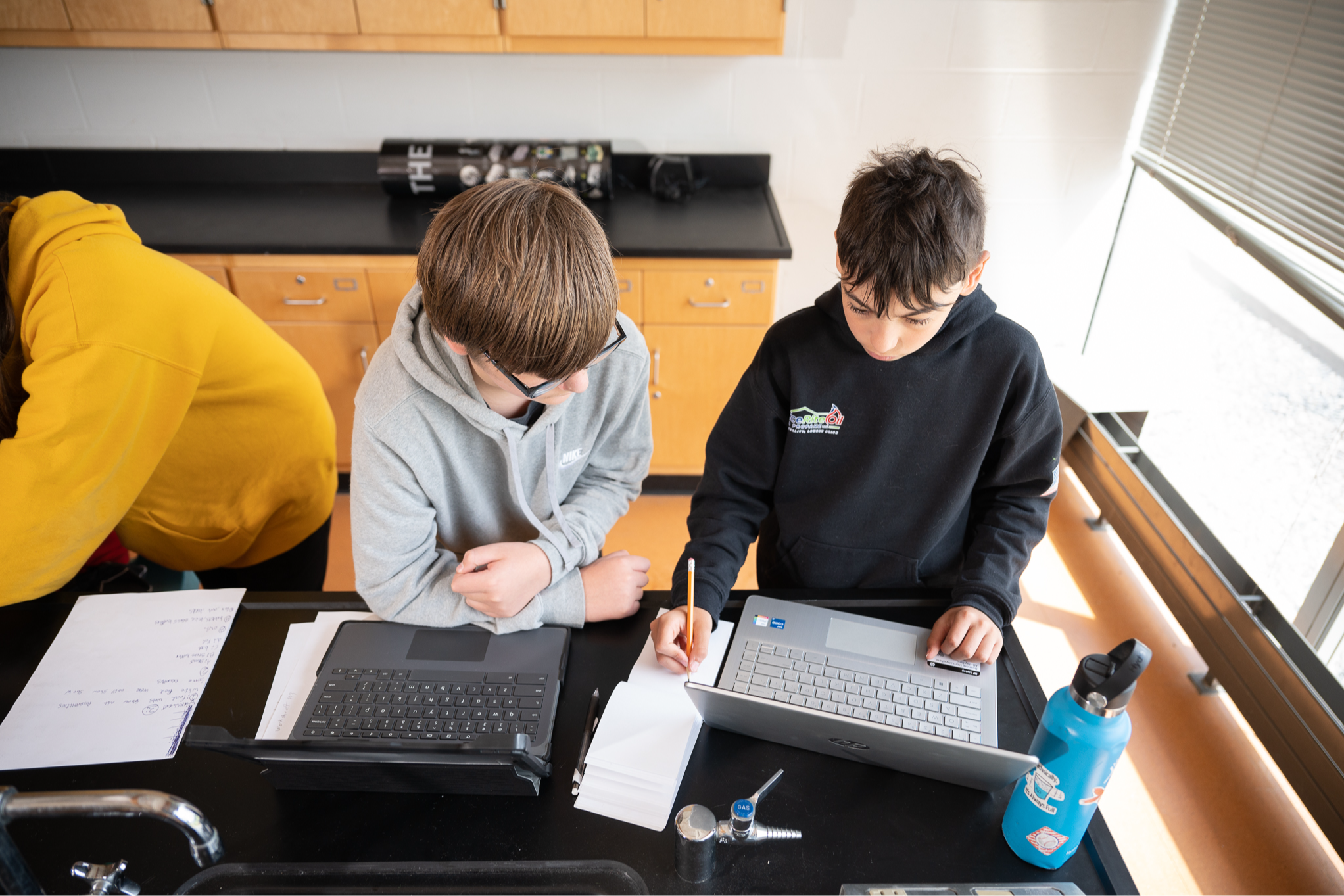 two kids at laptops