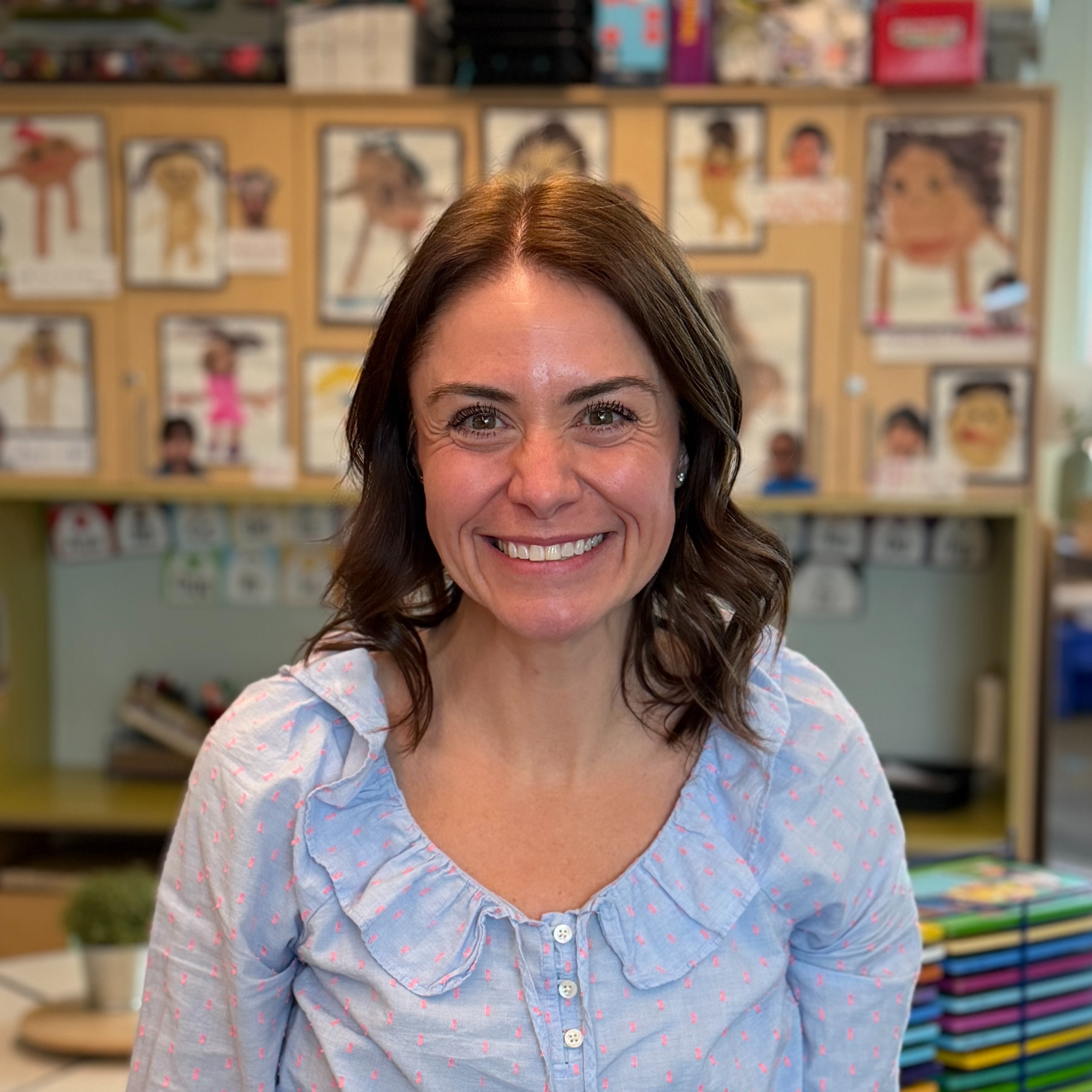 Carly Seidler posing for a photo in her clasroom.