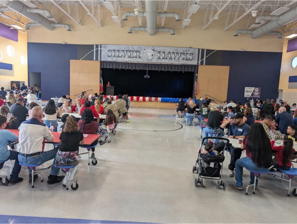 Military families sitting for the ceremony