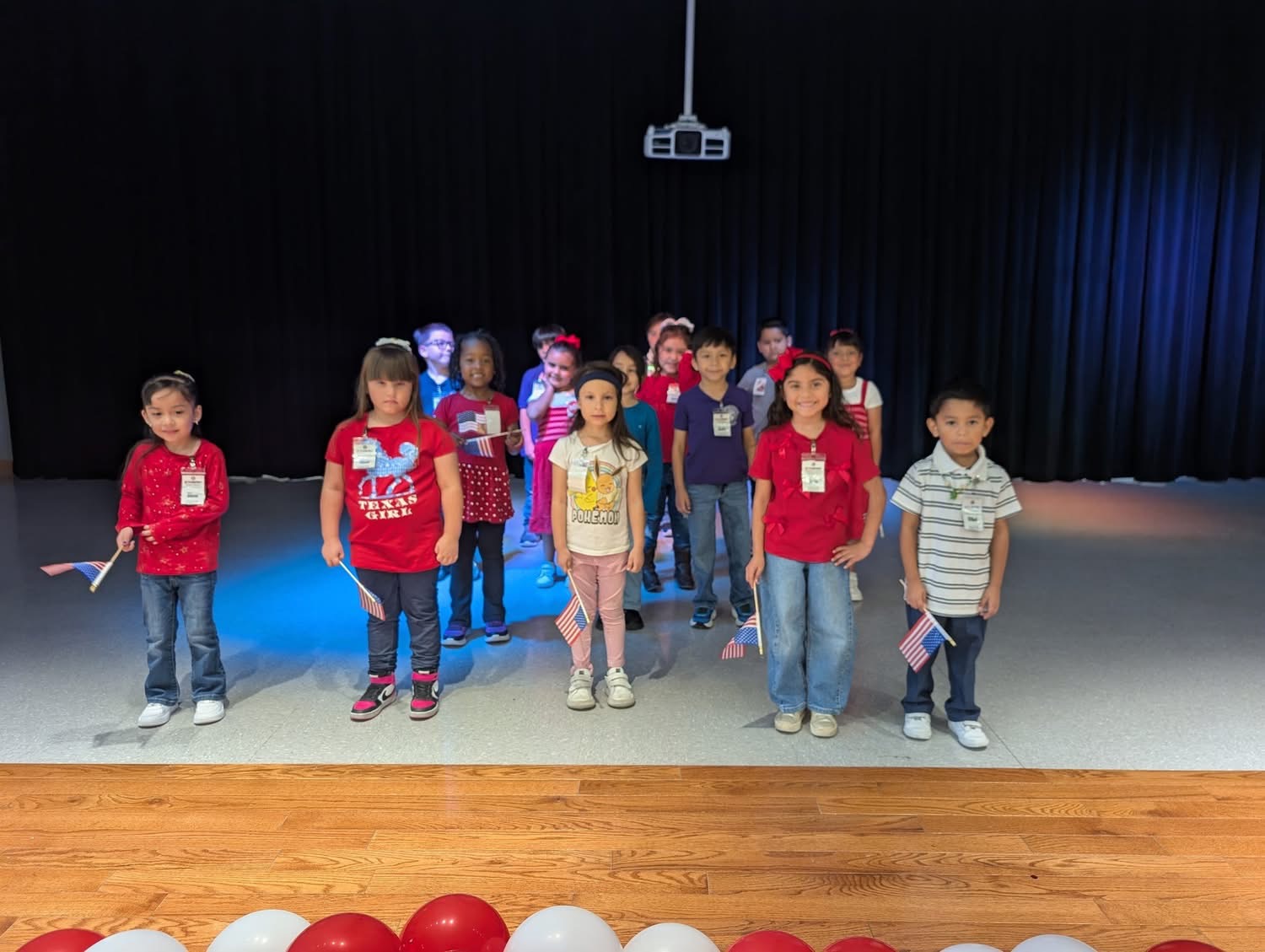 Students performing on stage