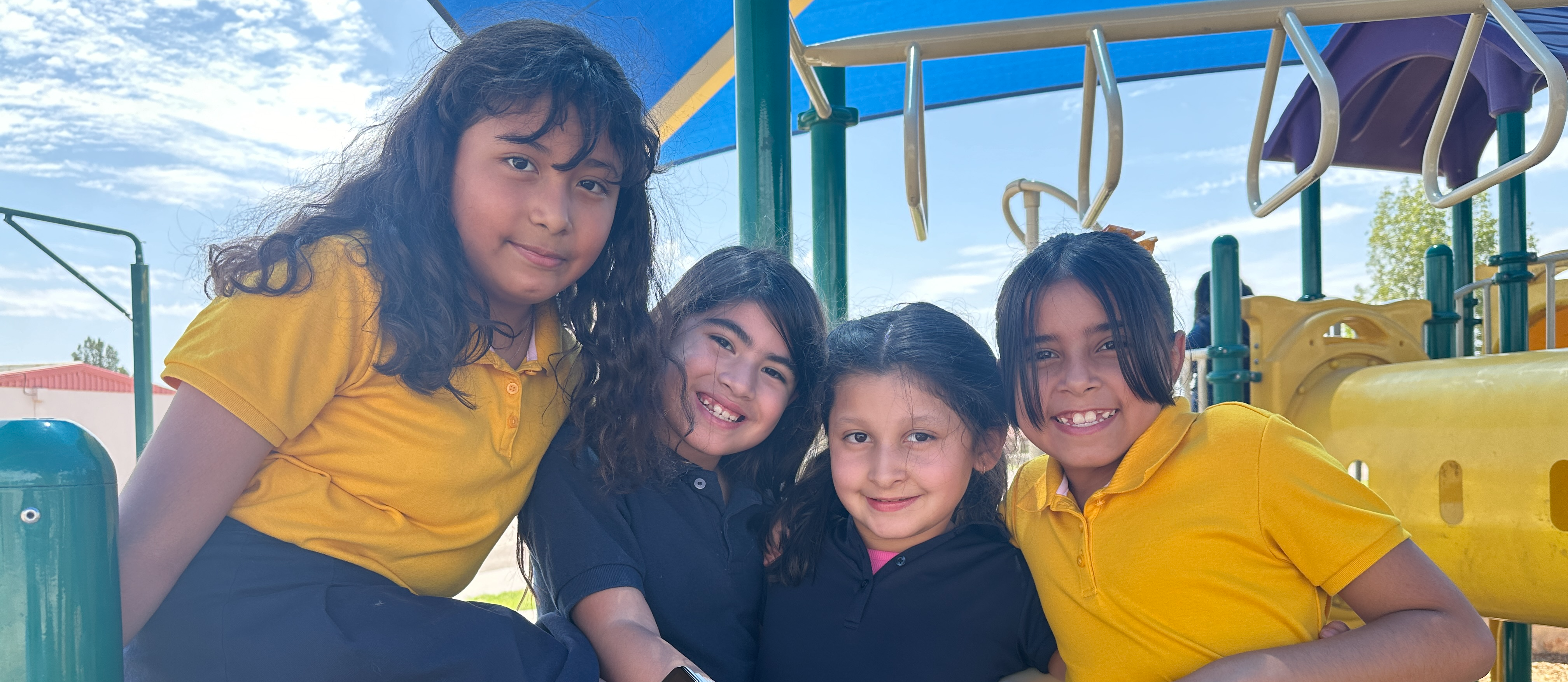 EHES girls smiles for the camera during recess