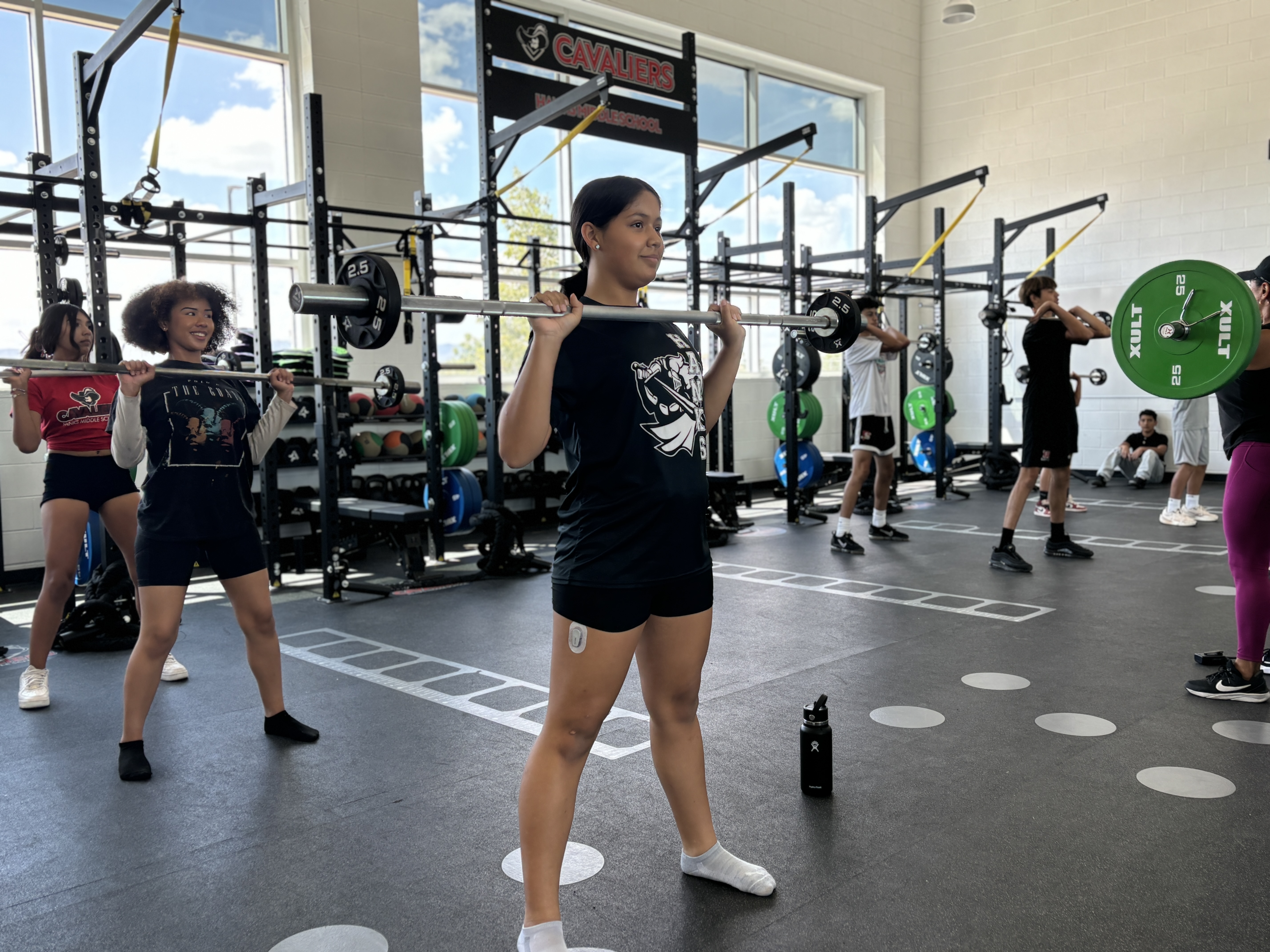 Female student lifting weights