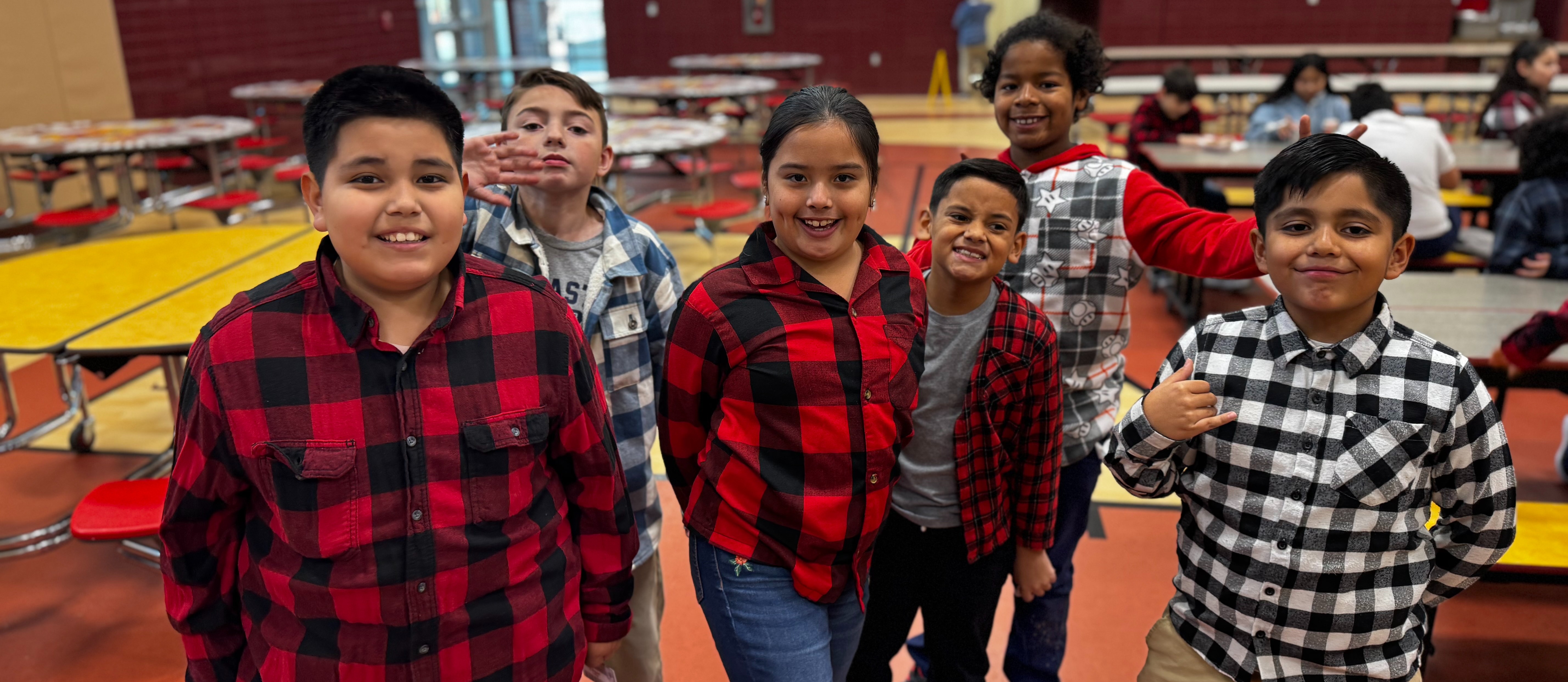 Aztec students wearing flannel shirts.