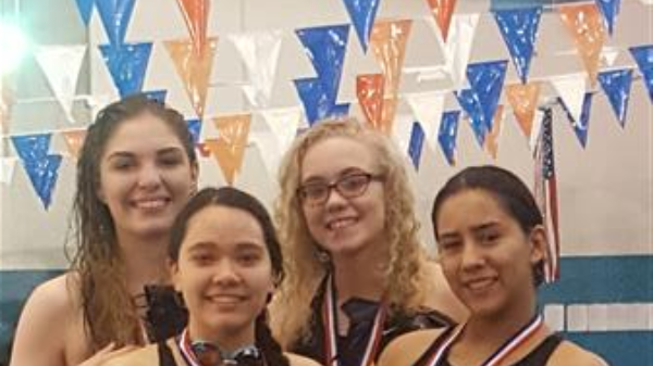 swimmers smiling at the camera