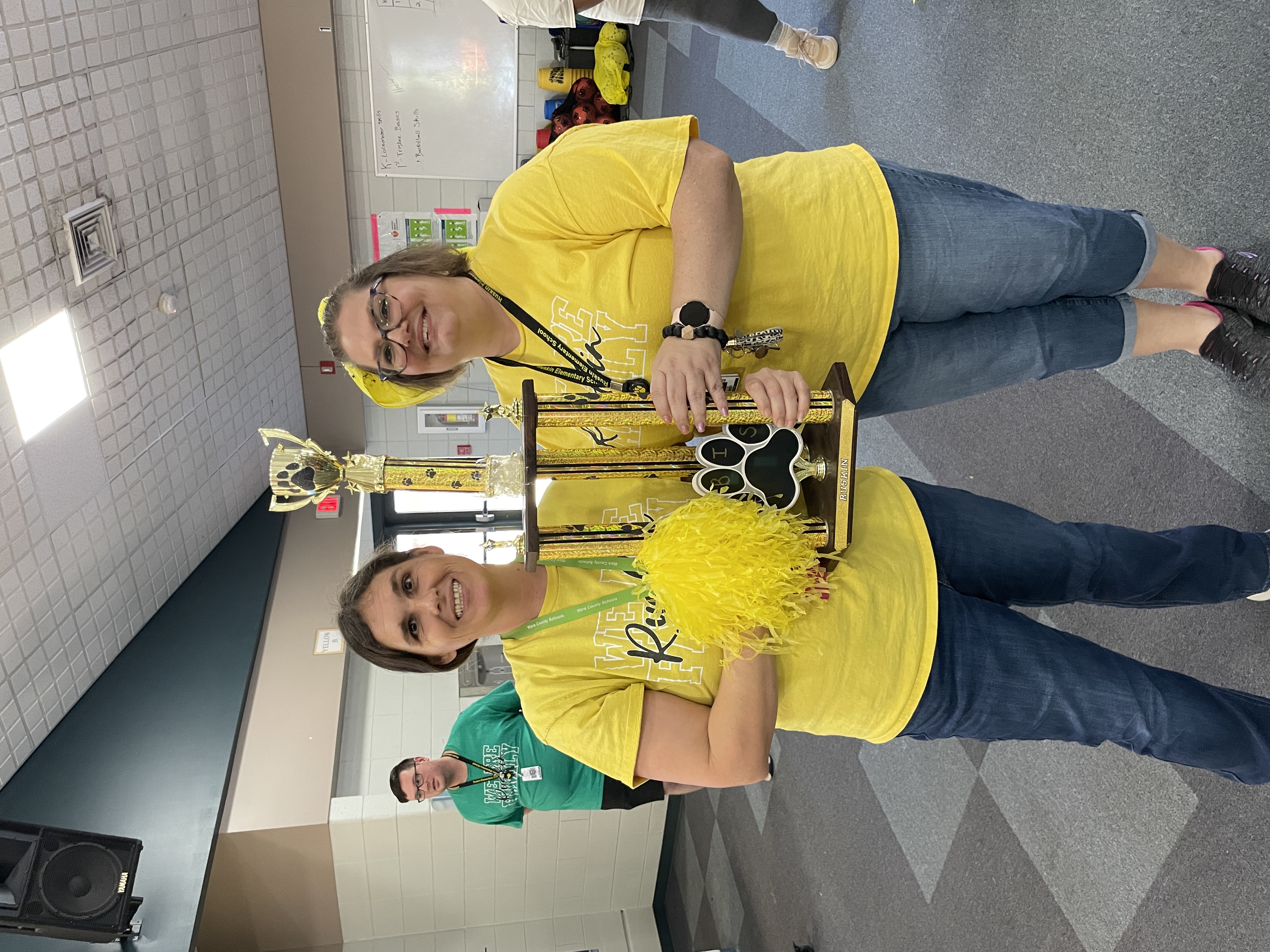 Mrs. Waters and Mrs. Hodges standing with PBIS trophy