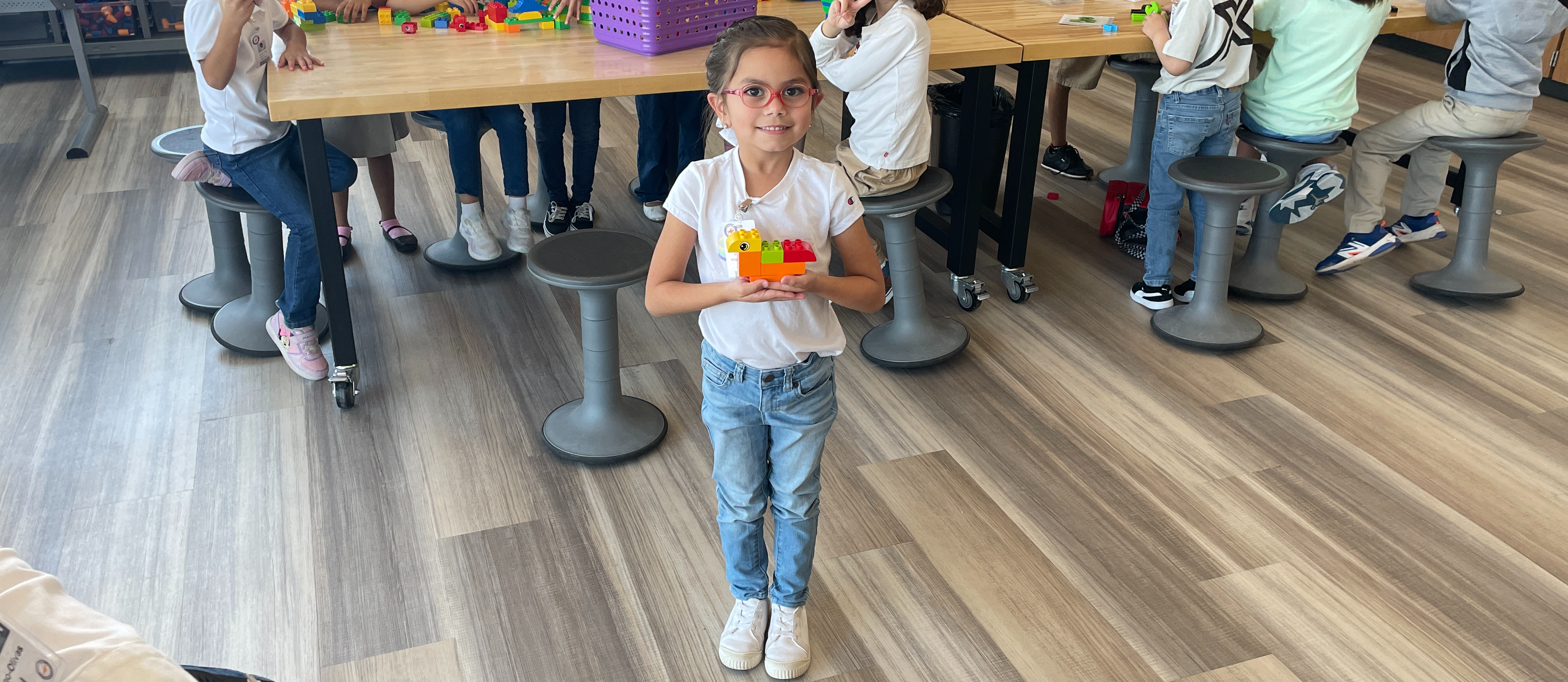 Little girl Holding Legos