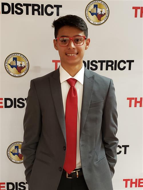 boy smiling wearing a suit