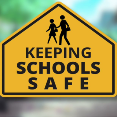 Keeping schools safe road sign
