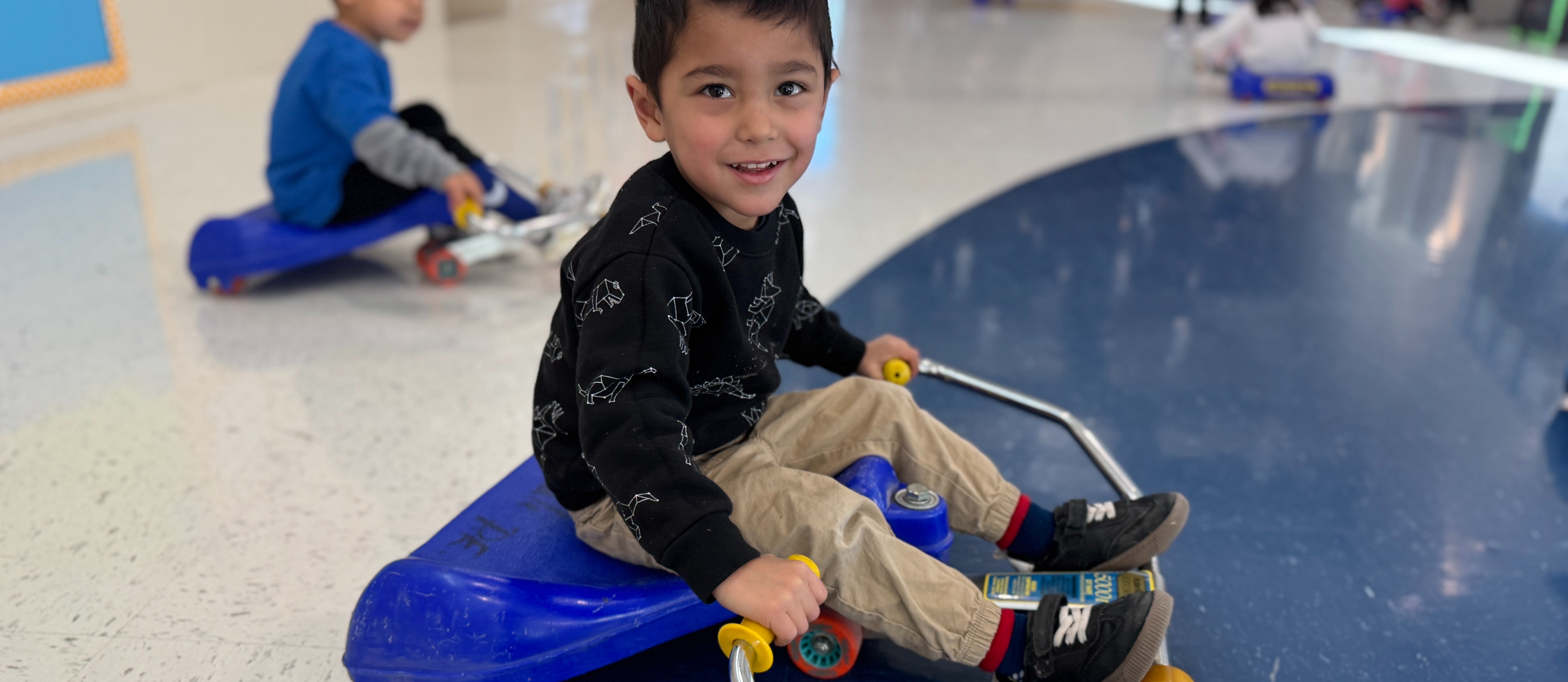 “Zooming into fun and learning! 🚀✨ Our little Cadet is rolling through preschool with a big smile and endless curiosity! 🛴💙 #PreschoolAdventures #ScotsdaleCadets”