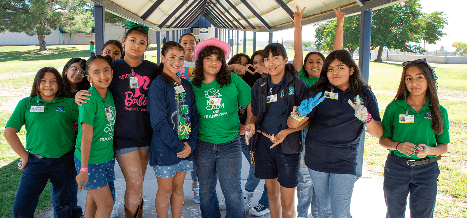 Young women under the canopy smiling at the camera