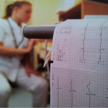 EKG technician preparing an ekg reading