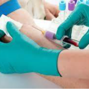 Phlebotomy technician drawing a sample of blood