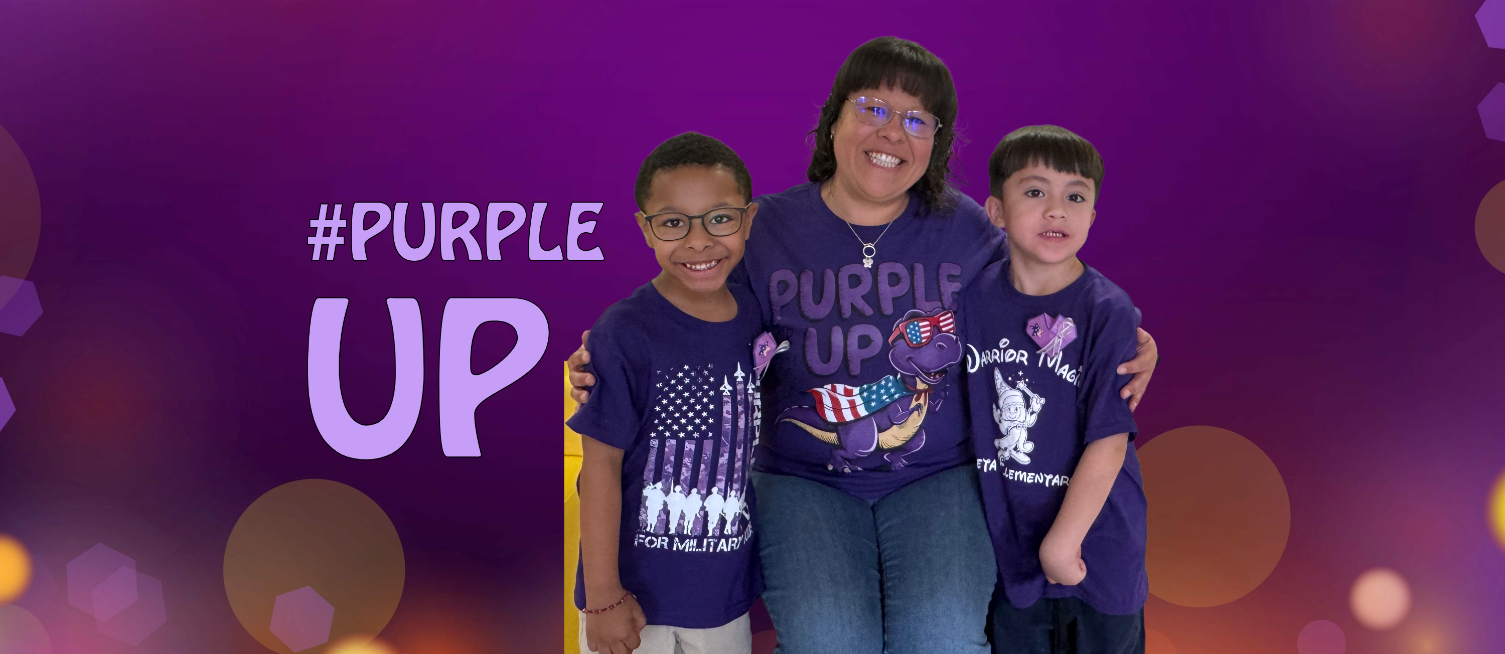 Students pose with a teacher all wearing purple to celebrate the Day of the Military Kid