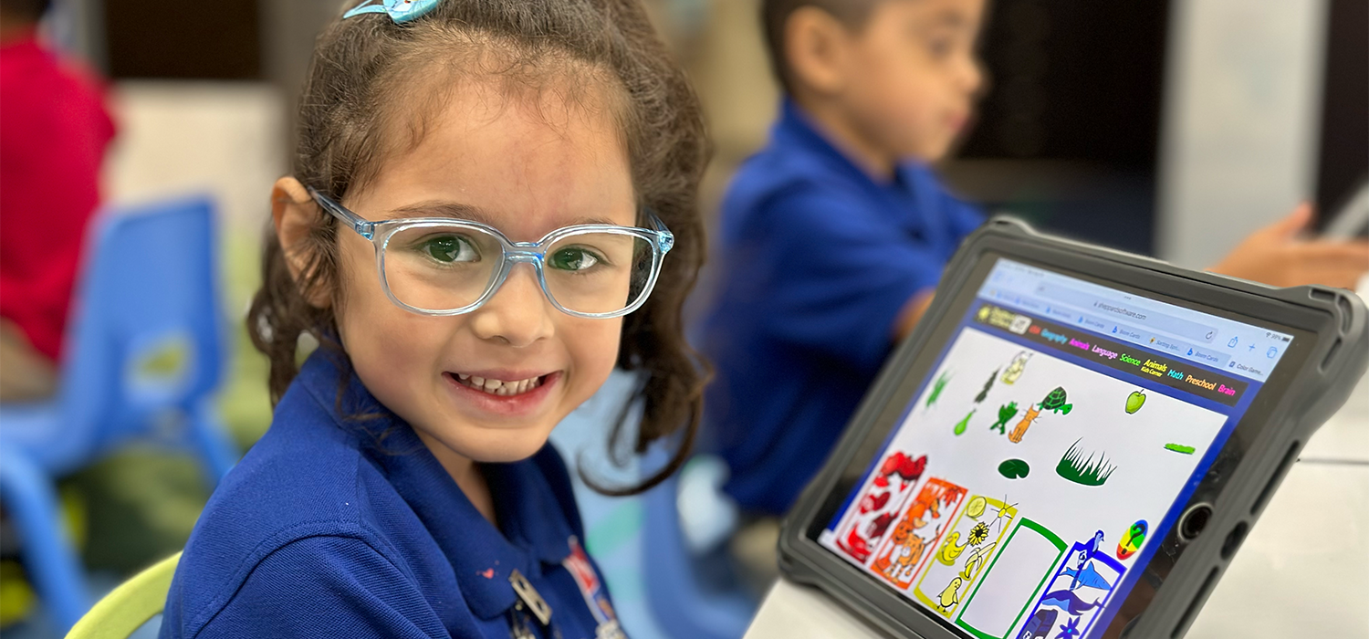 girl with eyeglasses on ipad