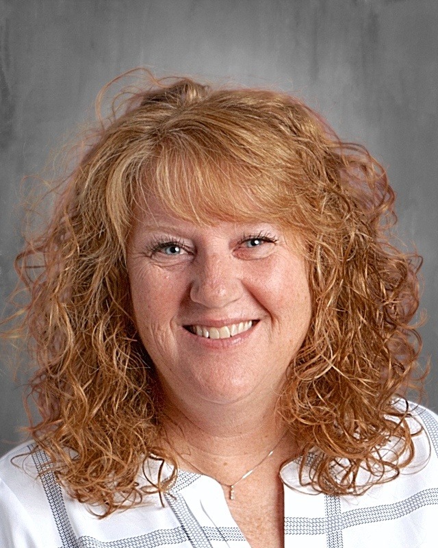 Woman with red curly hair