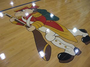 gym floor with mascot image on the wooden floor 