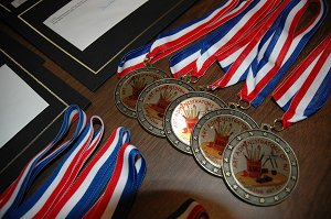 Close up of medals sitting on a table