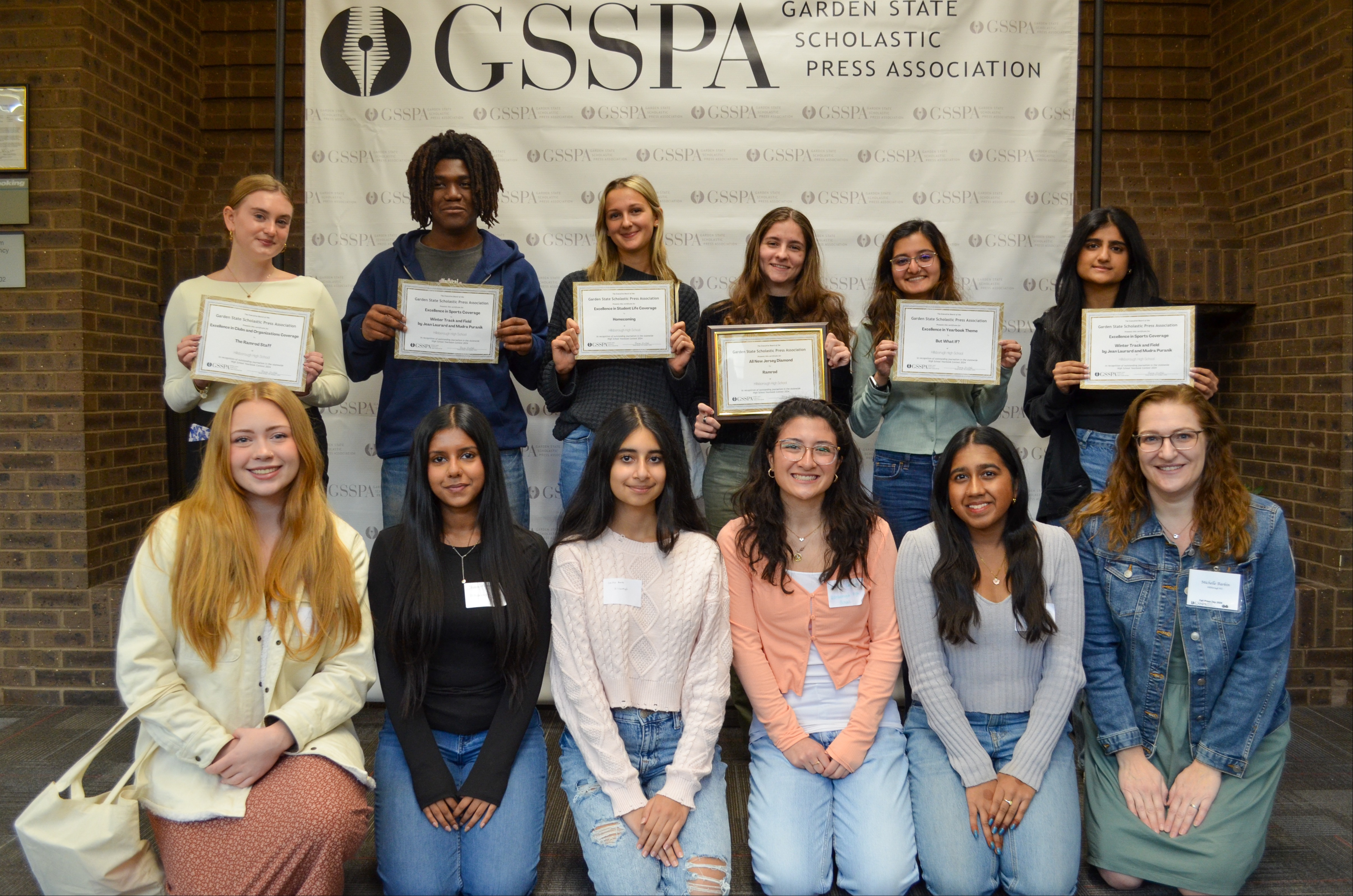 students accepting award for the yearbook