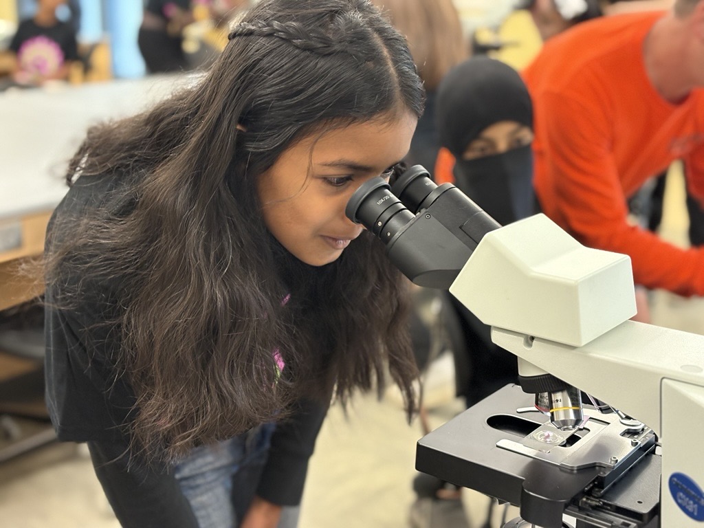 Girl Looking in Microscope