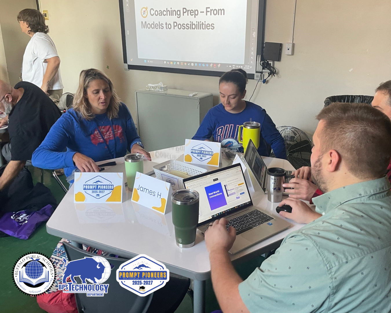 3 teachers at a desk