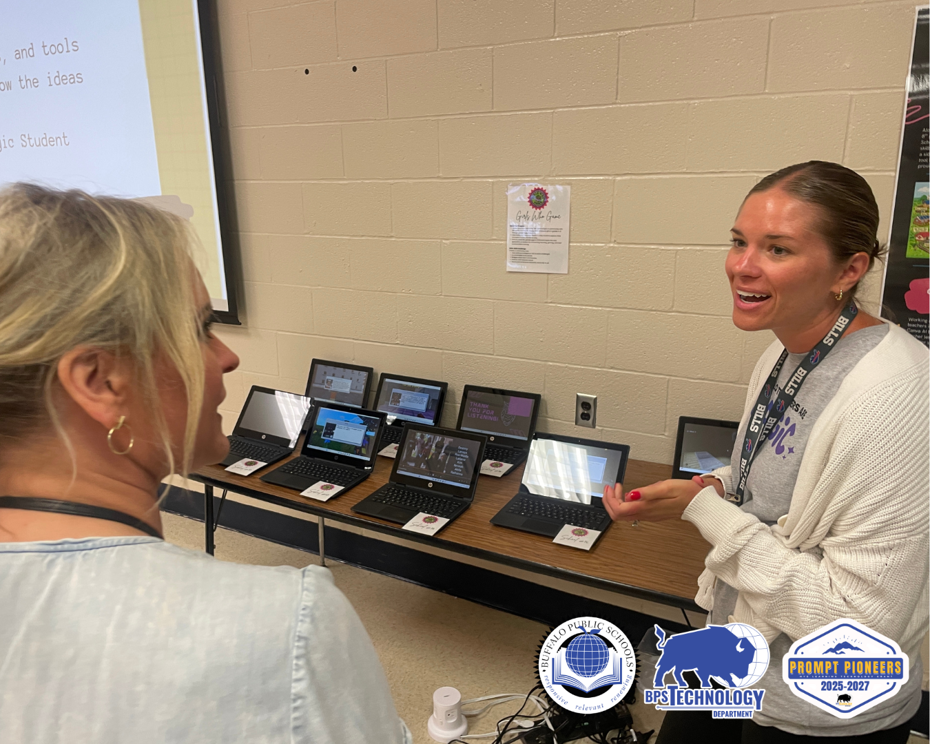 Two Teachers talking about laptops