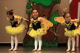girls dresses as bees