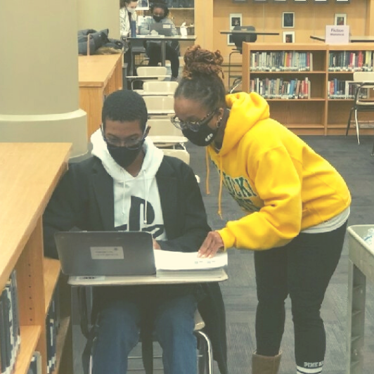 Warren Central student receives help from academic coach during Saturday tutoring session