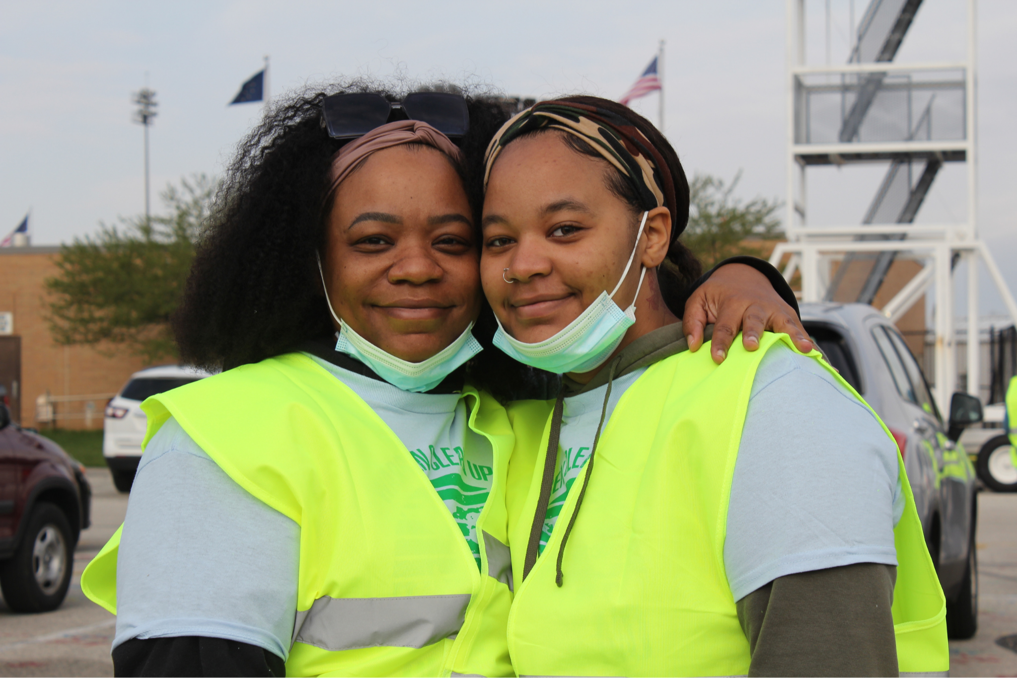 Girls posing for a picture in safety uniforms